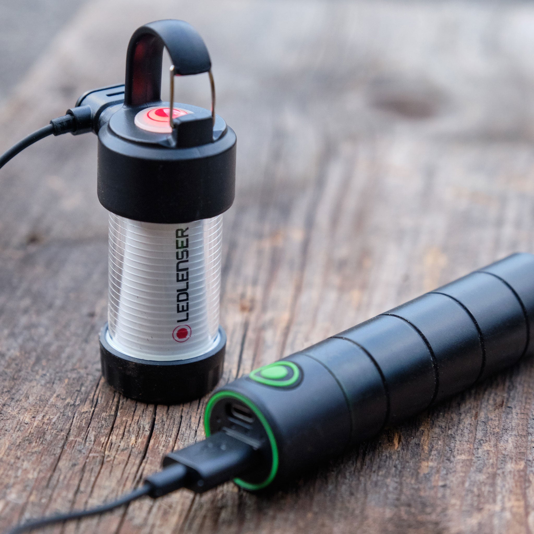 Ledlenser Flex3 Powerbank with connected USB cable and compact lantern module on a wooden surface