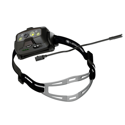HF8R Signature Headlamp by Ledlenser mounted on a black head strap with charging cable and multi LED array