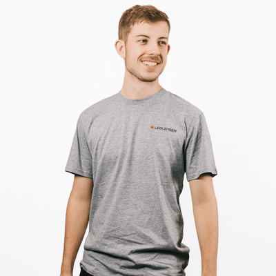 Mulga x Ledlenser Unisex Tee Aussie Animalia model wearing grey t shirt with Ledlenser logo on chest side view