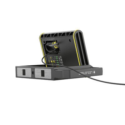 AF8R Work Floodlight on charging dock with rear control panel and LED indicators yellow and black rugged housing