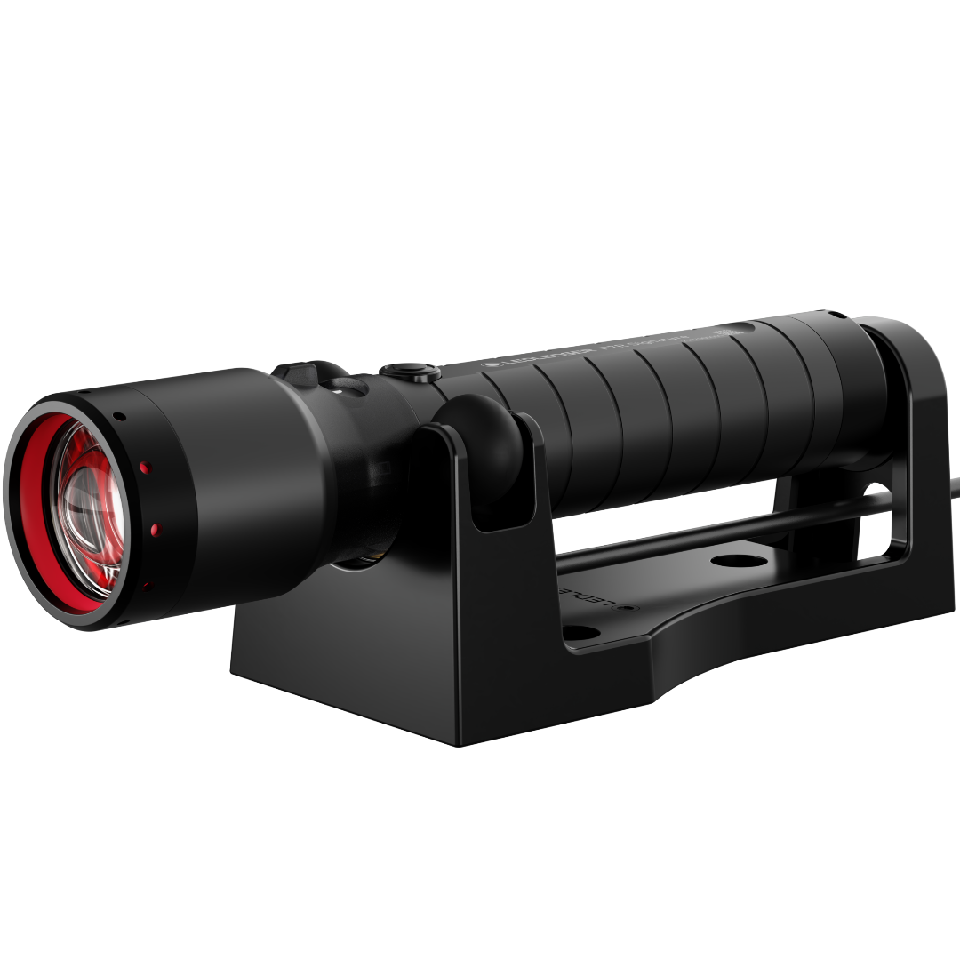 Ledlenser P7R Signature Torch mounted in a black charging cradle with red front ring