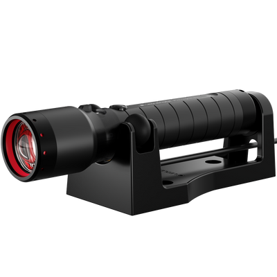 Ledlenser P7R Signature Torch mounted in a black charging cradle with red front ring