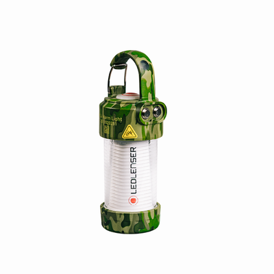 Ledlenser ML4 Warm Light Lantern in camouflage finish front view with white lantern tube red control button on camo cap and carrying handle