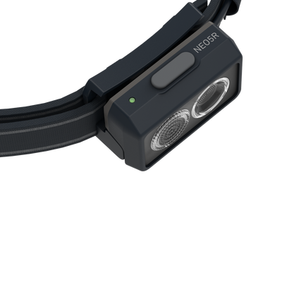 NEO5R Running Headlamp by Ledlenser featuring a dark gray body adjustable strap and compact front light viewed from a low angle