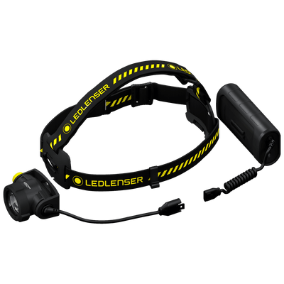 Ledlenser H15R Work Headlamp with black and yellow adjustable headband and external battery pack connected by a coiled cable