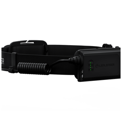 Ledlenser H5R Core Headlamp with black headband and attached charging cable showing side green indicator LEDs