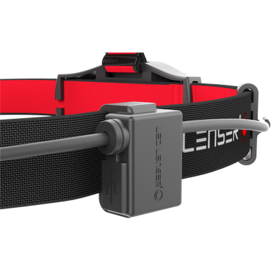 H6R Headlamp close up showing red and black adjustable headband with grey battery pack mount and cable