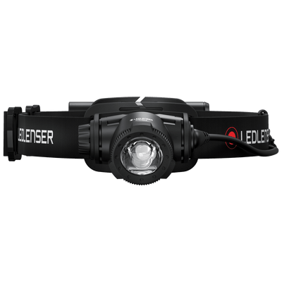Ledlenser H7R Core headlamp with black adjustable headband and central lens side view showing branding on strap