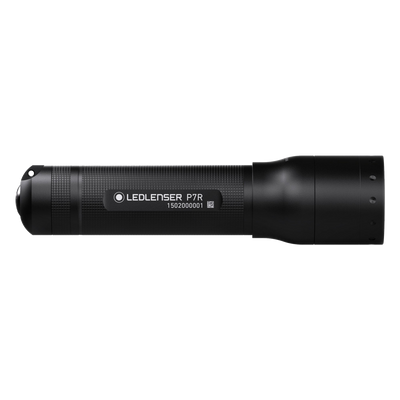 Ledlenser P7R Torch lying horizontally black cylindrical rechargeable torch with textured grip and label