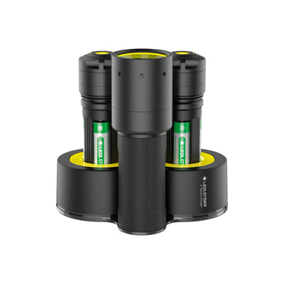 i7R Rechargeable Torch in a triple bay charging dock with two removable batteries black knurled handle and yellow lens area