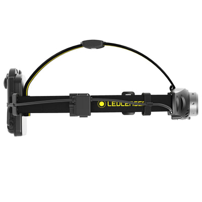 Ledlenser iH6 Battery Operated Headlamp in side view with black head strap and yellow logo showing front lamp housing and rear battery pack