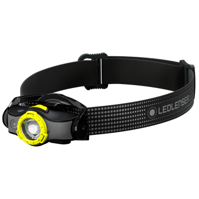 Ledlenser MH5 outdoor headlamp with black headband and yellow front bezel worn on head in profile view