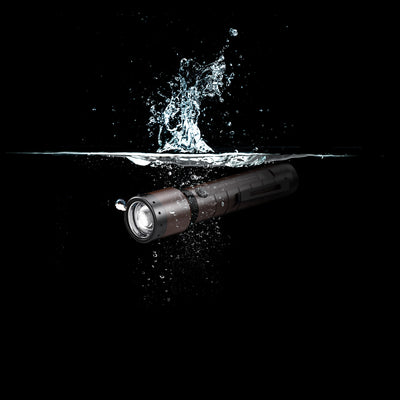 Ledlenser P7R Signature Torch submerged in water horizontal orientation black with brown accents