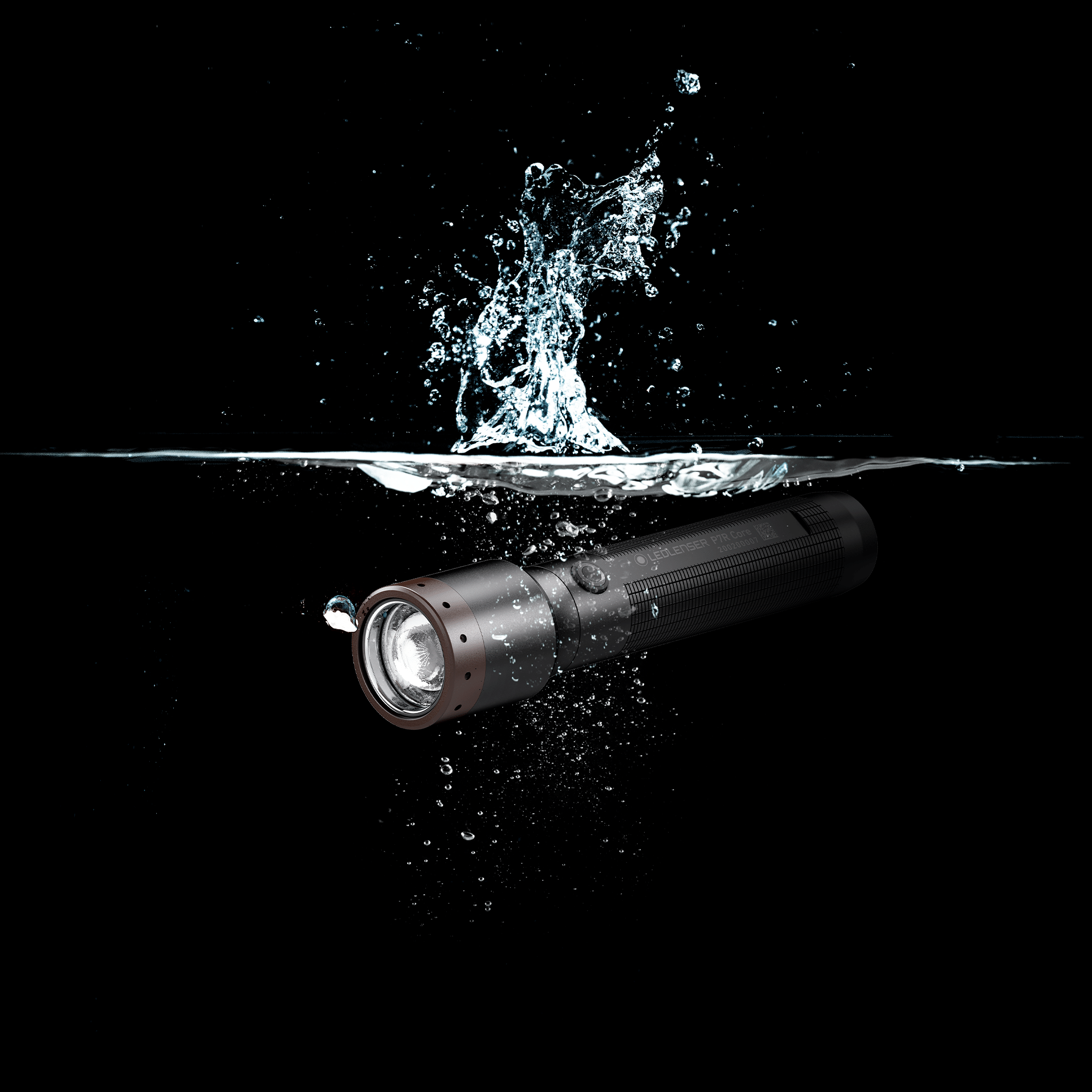 Ledlenser P7R Core Torch submerged in water with splash showing a black cylindrical body and brown bezel