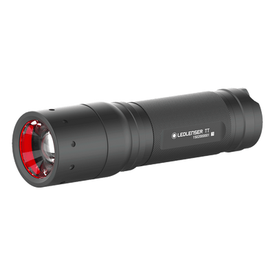 Tac Torch by Ledlenser compact black handheld tactical torch with knurled grip and red bezel angled view