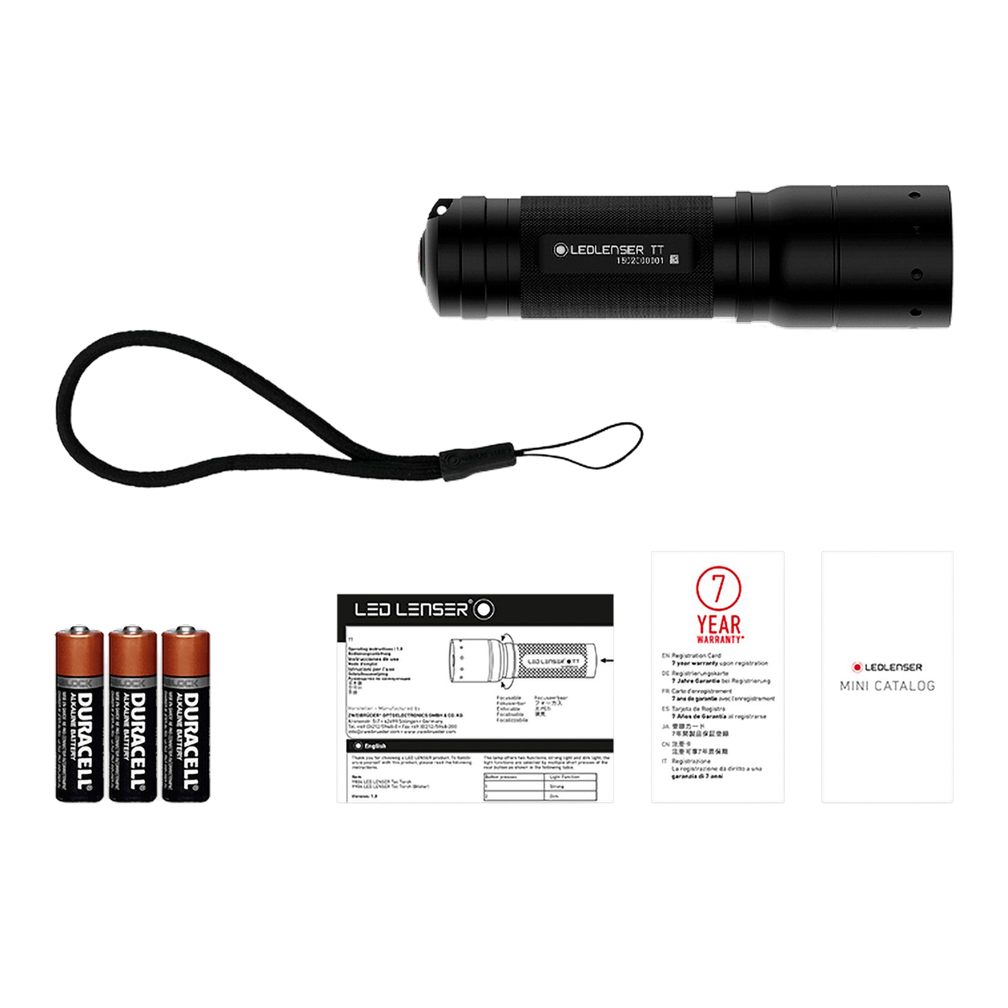 Tac Torch TT black compact flashlight with included lanyard three Duracell batteries and accompanying manuals and catalog