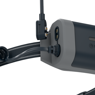 NEO5R Running Headlamp in side view with head strap mounting hinge and attached cable dark blue gray housing