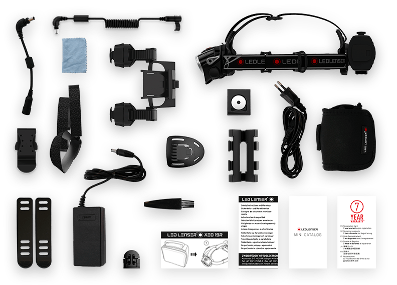 Ledlenser XEO19R Rechargeable Headlamp with kit contents including headlamp on strap battery pack charger extension cable mounts holster spare battery and manuals