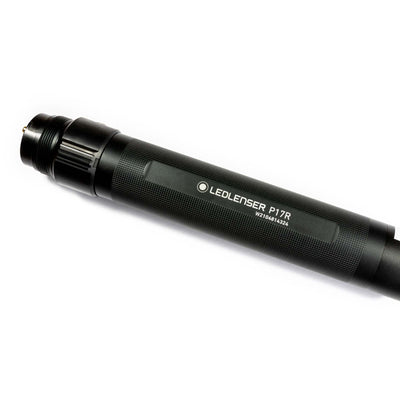 Ledlenser P17R Rechargeable Battery in Aluminium Tube w Rearcap shown as a black cylindrical tube with textured grip and rear cap