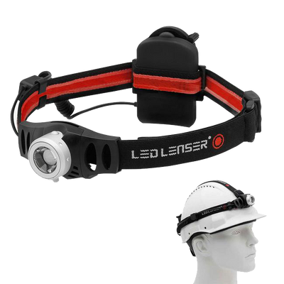 H6 Battery Operated Headlamp by Ledlenser with front light and silver bezel on black red head strap and battery pack