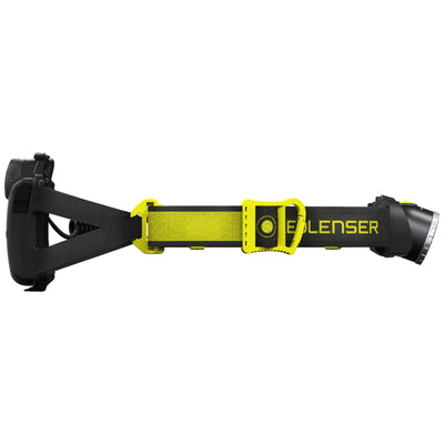 Ledlenser iH7R CRI Headlamp worn on head with neon yellow and black strap and compact front light
