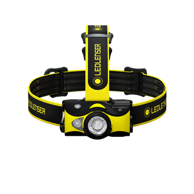 Ledlenser iH9R Headlamp mounted on a yellow and black adjustable headband front view showing lamp housing